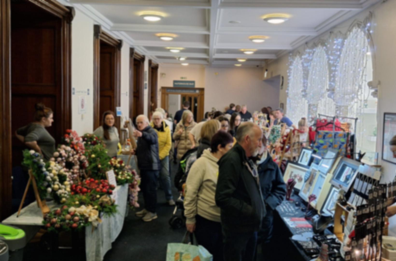 shoppers browsing a Christmas market