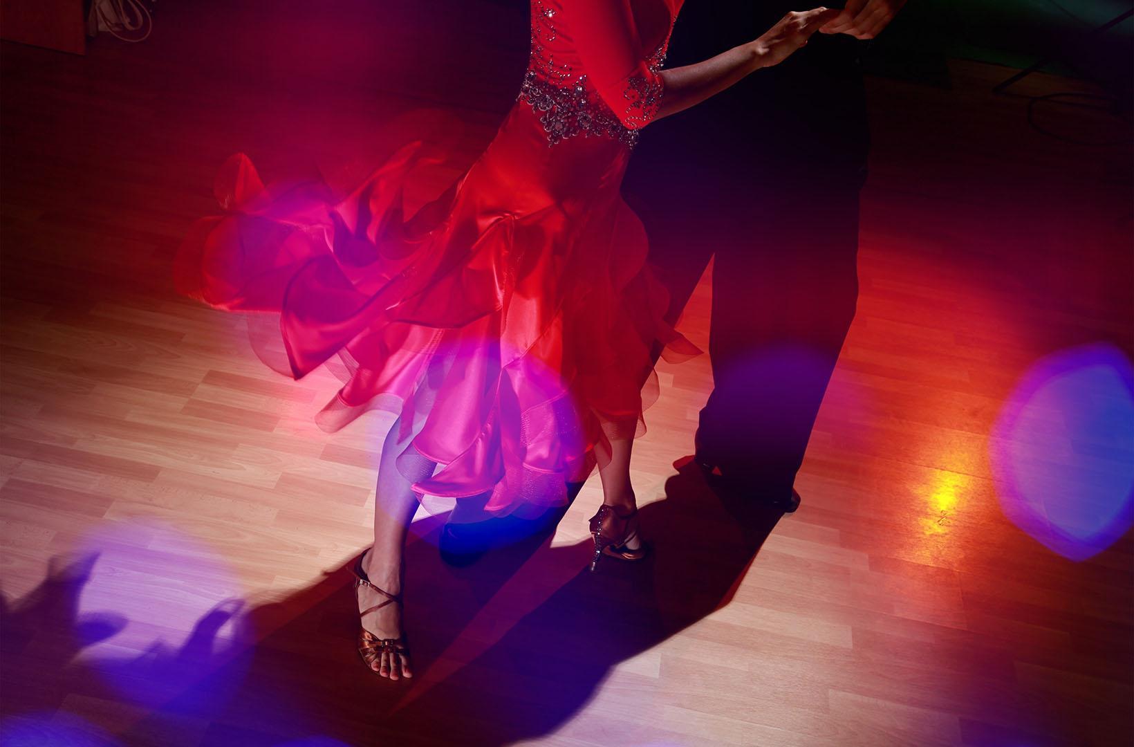 Male and female dancers on a dancefloor