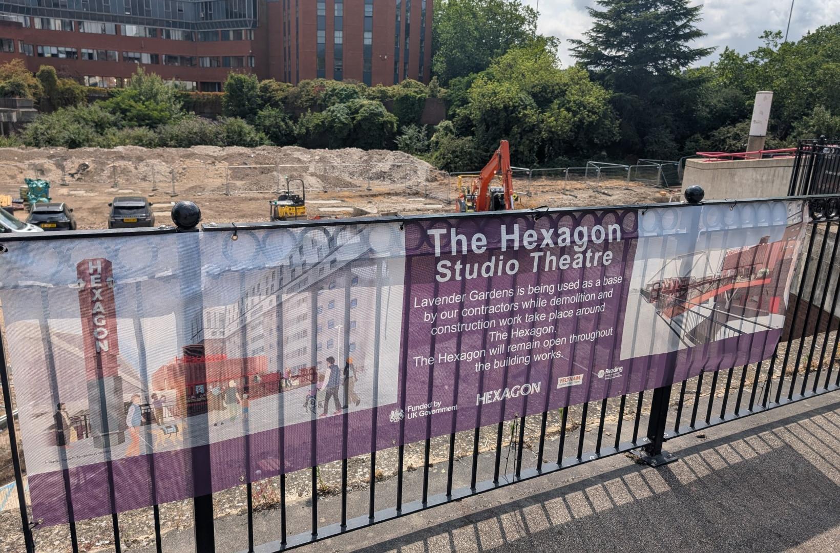 View of the Hexagon theatre building site with a banner informing people about the plans