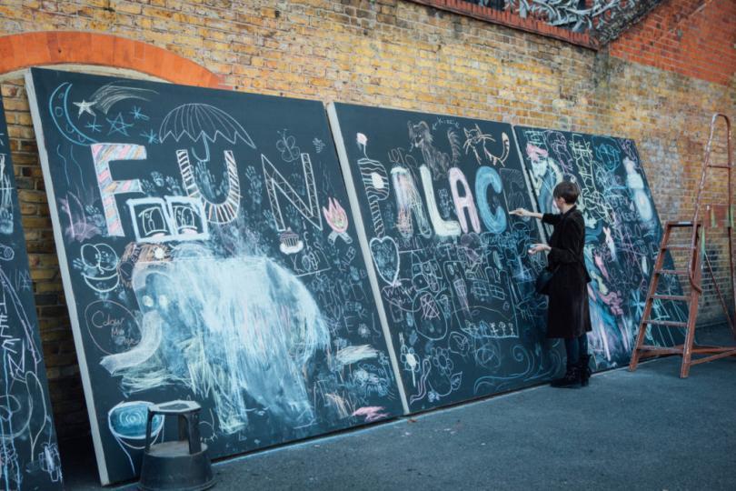 Blackboards with the words Fun Palaces chalked onto them. 
