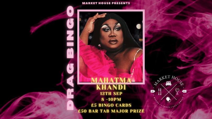 picture of mahatma khandi in front of a pink background