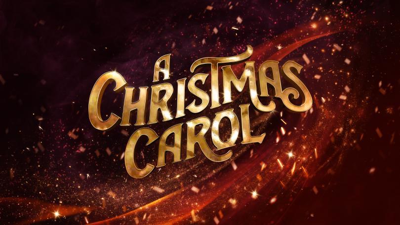 The title A Christmas Carol appears in large gold lettering against a rich red background filled with sparkling lights, swirling ribbons of colour and festive golden particles, creating a magical and celebratory Christmas atmosphere.