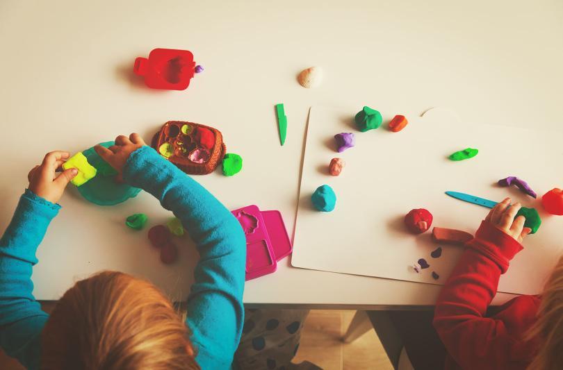 Children sitting making crafts