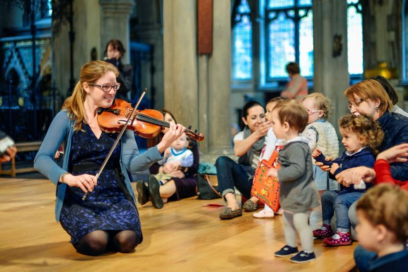 toddlers enjoying violinist at bach to baby concert