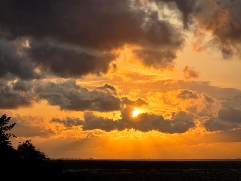 Photo of a sunset over Dråby Strand, Denmark.  