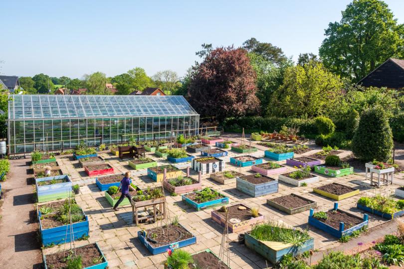 Gardens with planters and greenhouses
