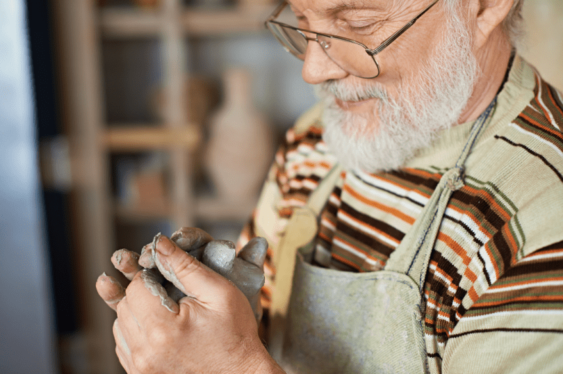 Man working with clay