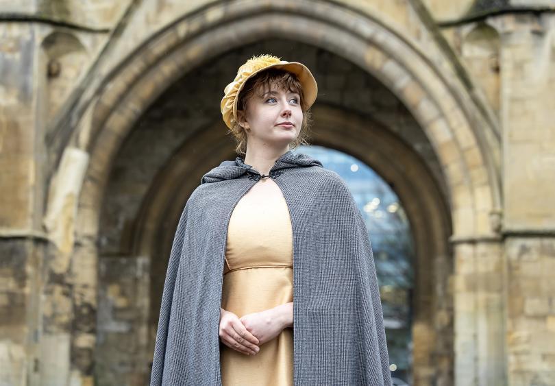 Volunteer Dressed as Jane Austin outside The Abbey Gateway