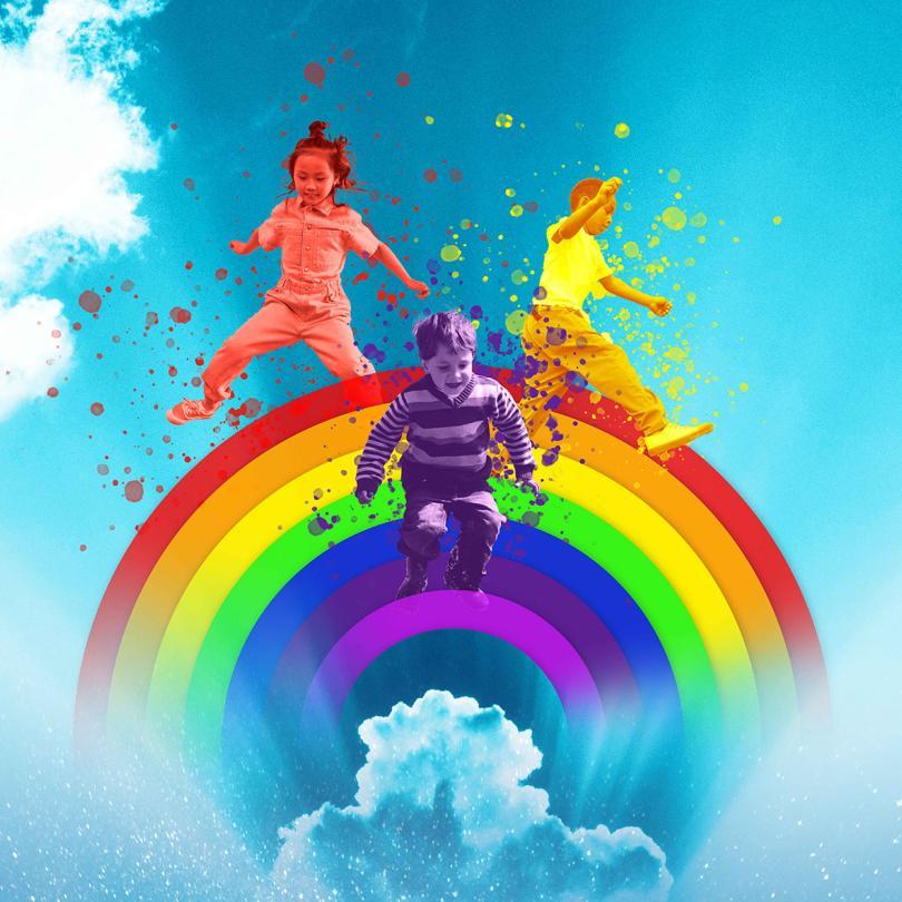 Children playing on a rainbow