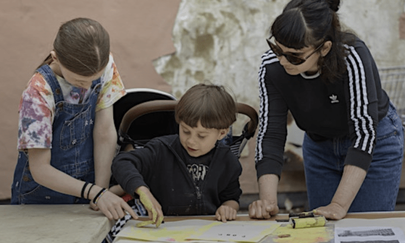 a family taking part in a printmaking activity
