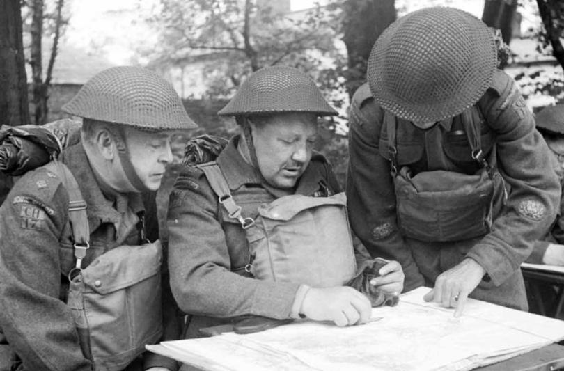 members of the Home Guard studying a map
