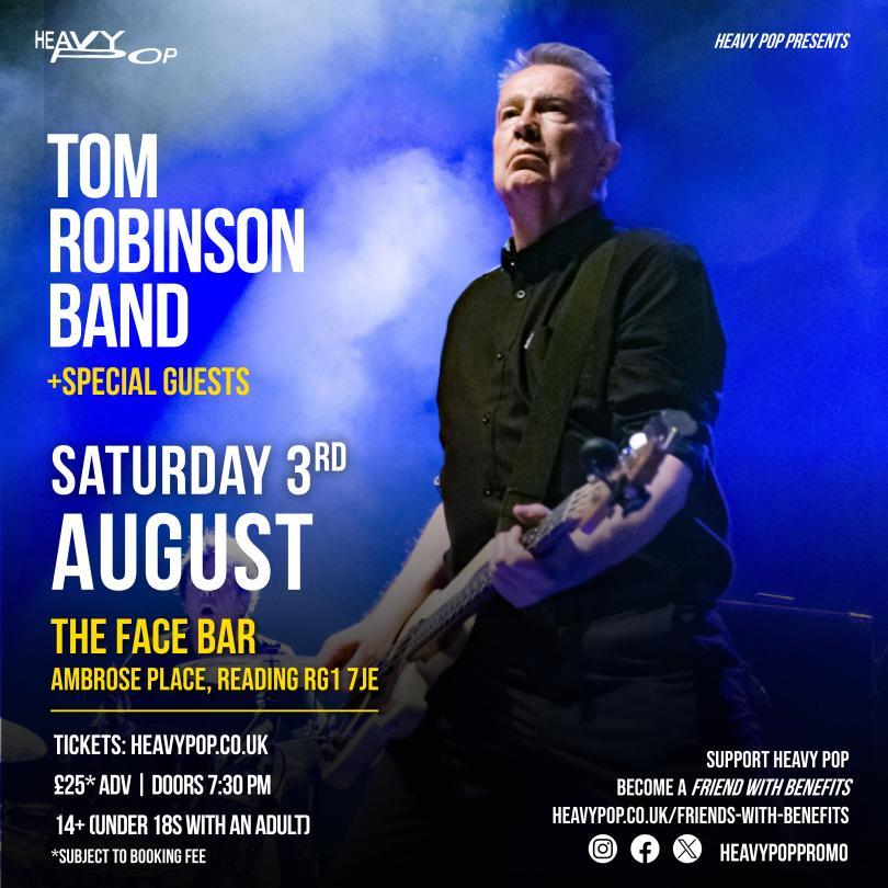 A pic of tom robinson playing bass