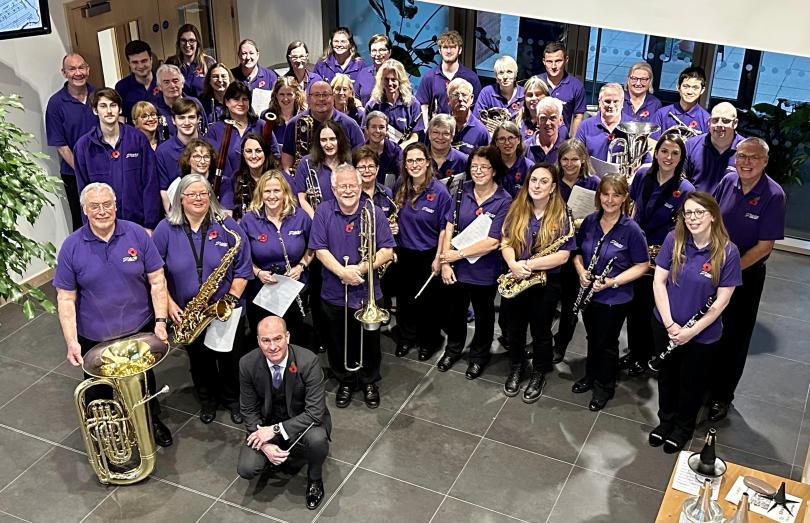 Members of Trinity Concert Band with their instruments - photo taken from above