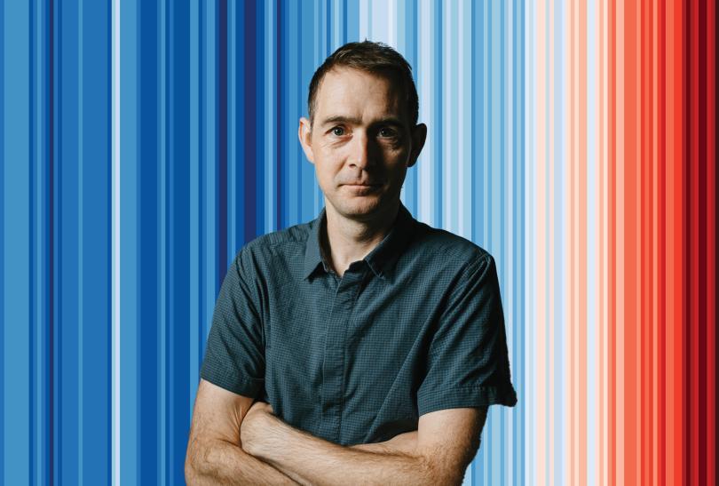 Professor Ed Hawkins in front of the Reading University Climate Stripes