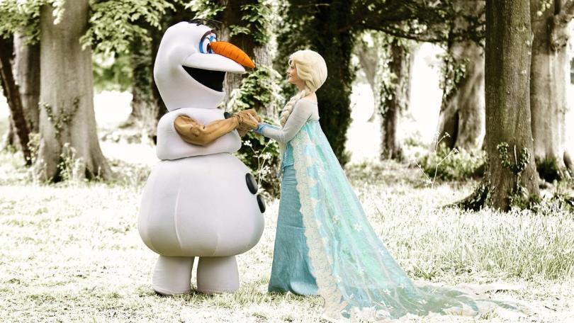 The images shows Olaf & Elsa in a wooded area.