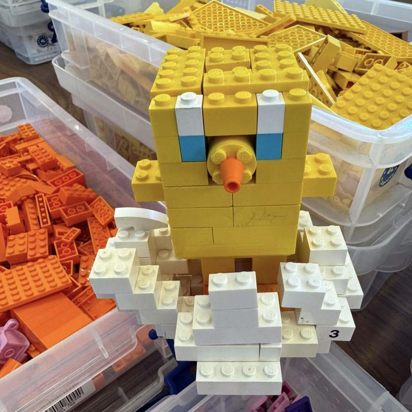 LEGO chick hatching from a LEGO shell