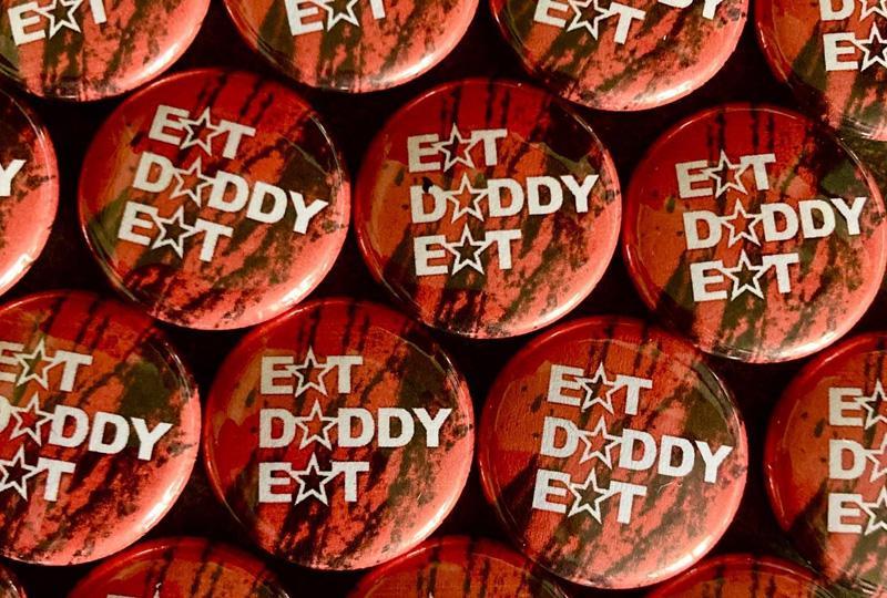 Badges adorned with Eat Daddy Eat text