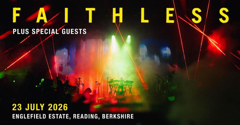 Faithless performing on stage with a massive light show