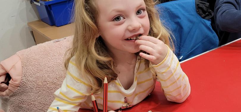 a girl eating chocolate