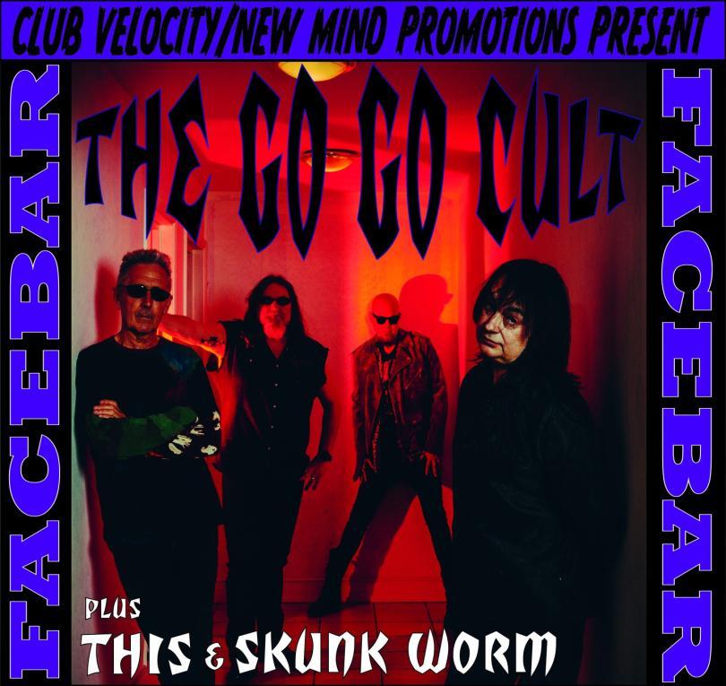 rock band the Gog Go cult looking moody in a corridor