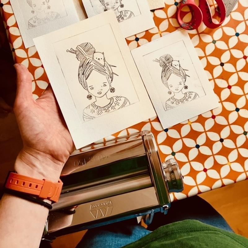 printed image of an illustration of a woman with a cat