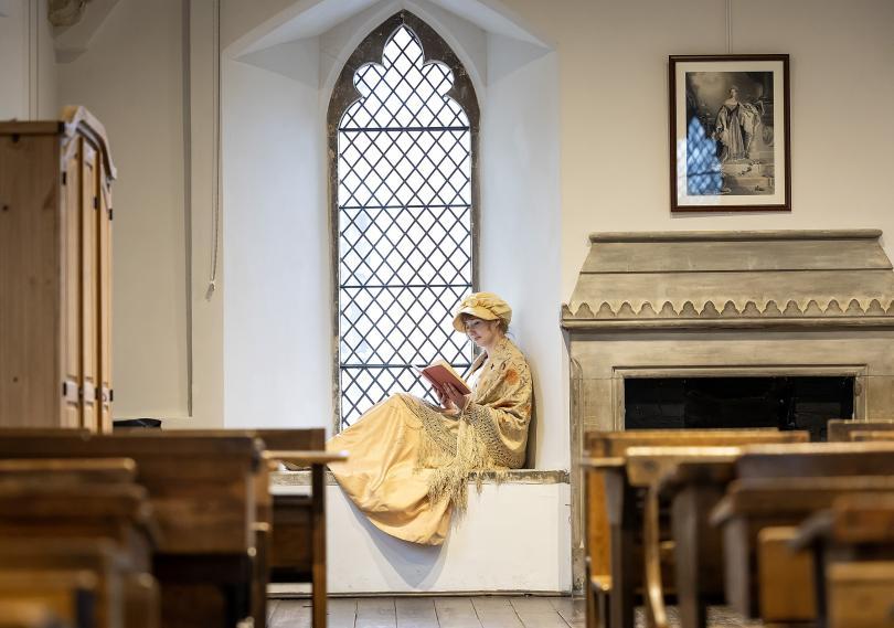 Jane Austen Costume Interpreter in the ABbey Gateway