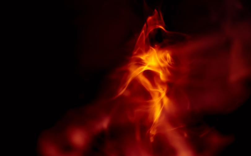 Dark background with hazy orange flames