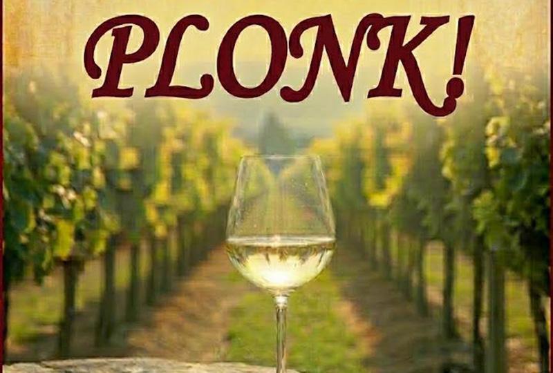 Poster with the title over a picture of a glass of wine in a vineyard