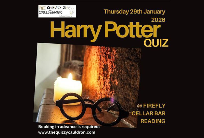 Poster featuring a close-up of a pair of round glassess near a candle