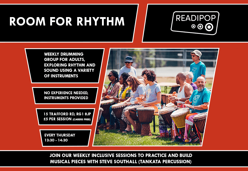 People drumming in the sun, information (as seen below) regarding the event.