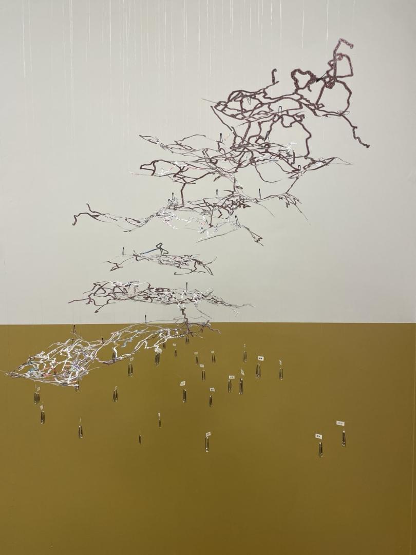 Sara Wong, From Hong Kong to London by bus the adventure begins. Paper, free newspaper collected from buses in Hong Kong and London, paper clip, metal calabash safety pin and nylon thread, 90cm x 60cm x 60cm, 2024