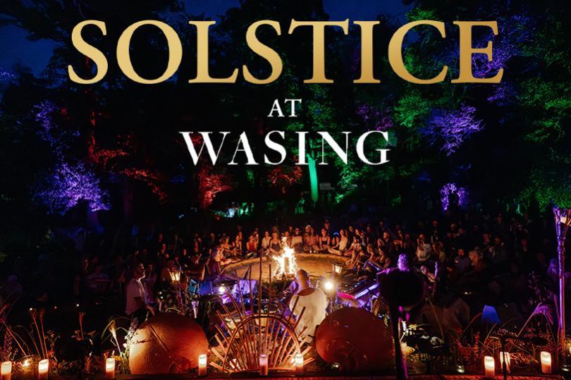 Solstice at Wasing title over an image of people celebrating in the woodland around a fire