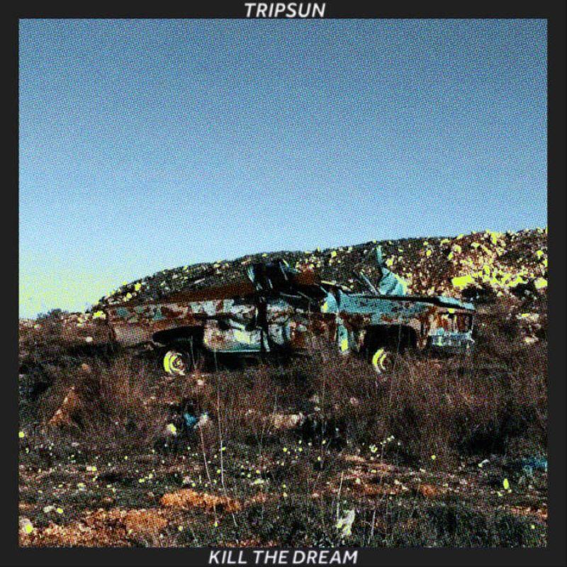 Album cover of blue sky over a burned out car in scrubland