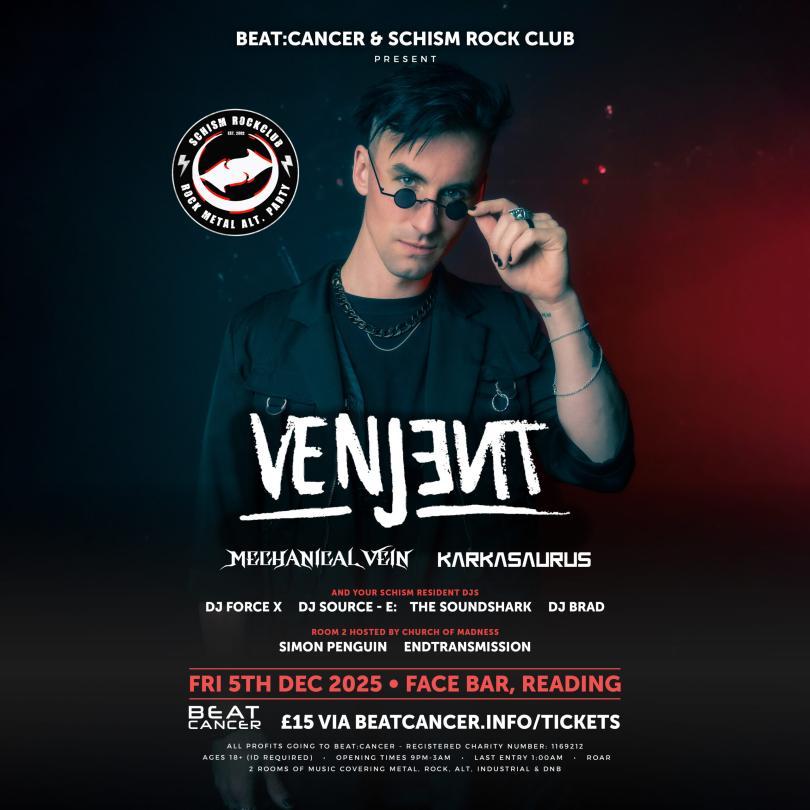 DJ Venjent pulling his sunglesses down from his eyes and looking cool while doing so