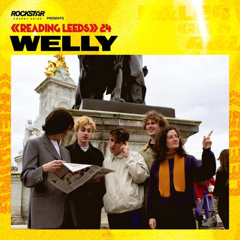 band pic with their Reading fest artwork