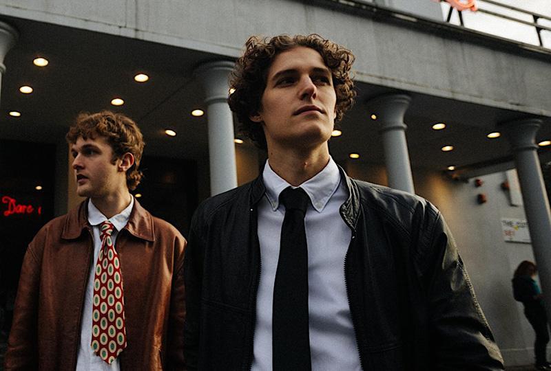 Two white men in jackets and ties