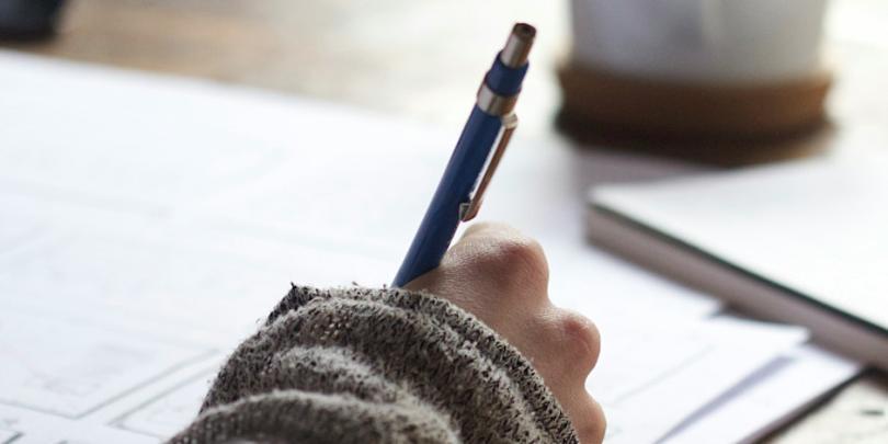 hand writing with a ball point pen