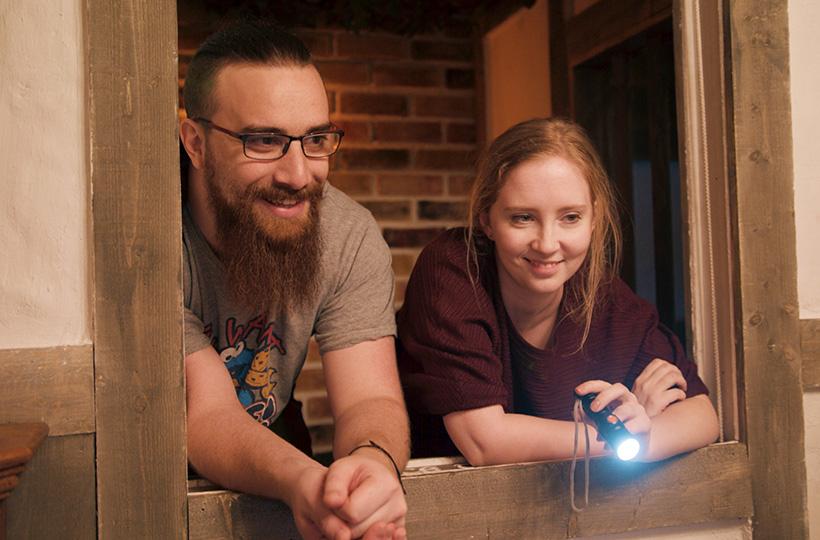 Couple playing Pudding Lane escape room at TimeTrap in Reading