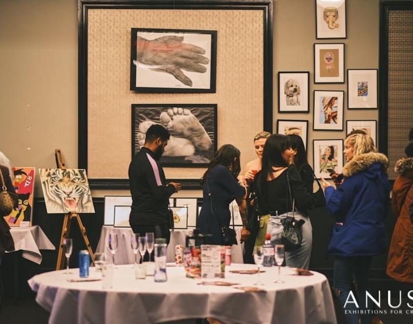 people mingling at an ANUSA exhibition