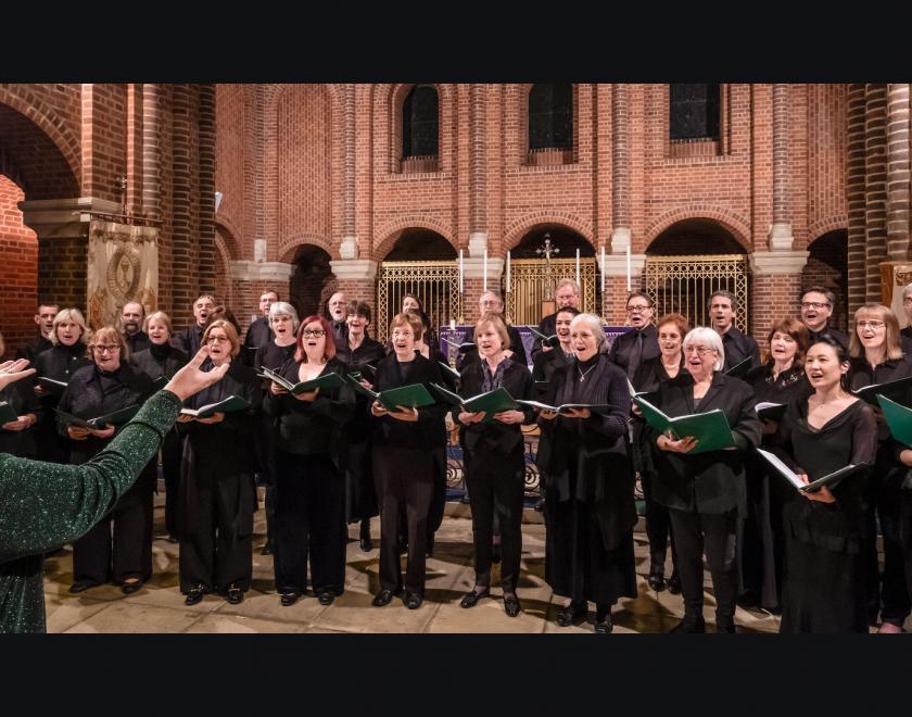 the cecilia consort choristers dressed in black and singing