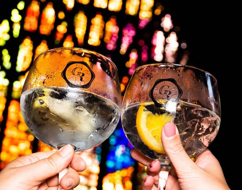 LArge gin glasses clinking together