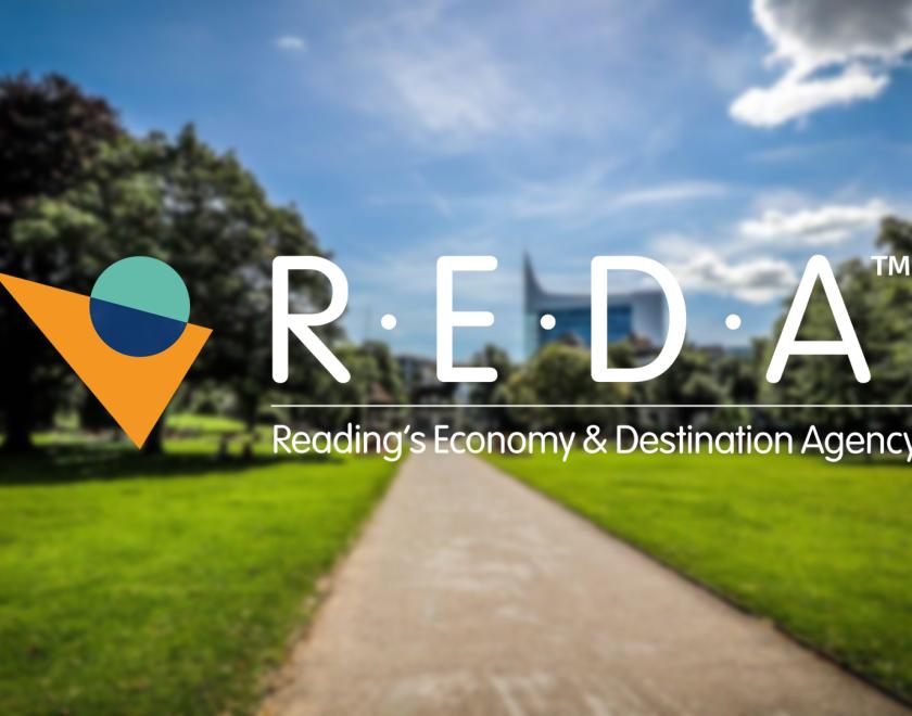 REDA Logo over a fuzzy image of Forbury Gardens