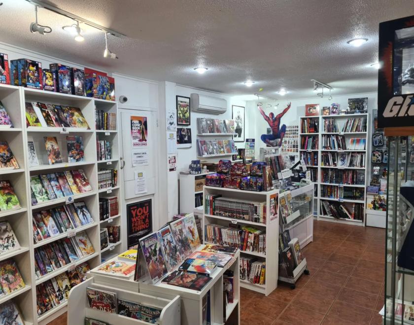 Interior of Crunch Comics shop, with lots of comics and merch on the shelves