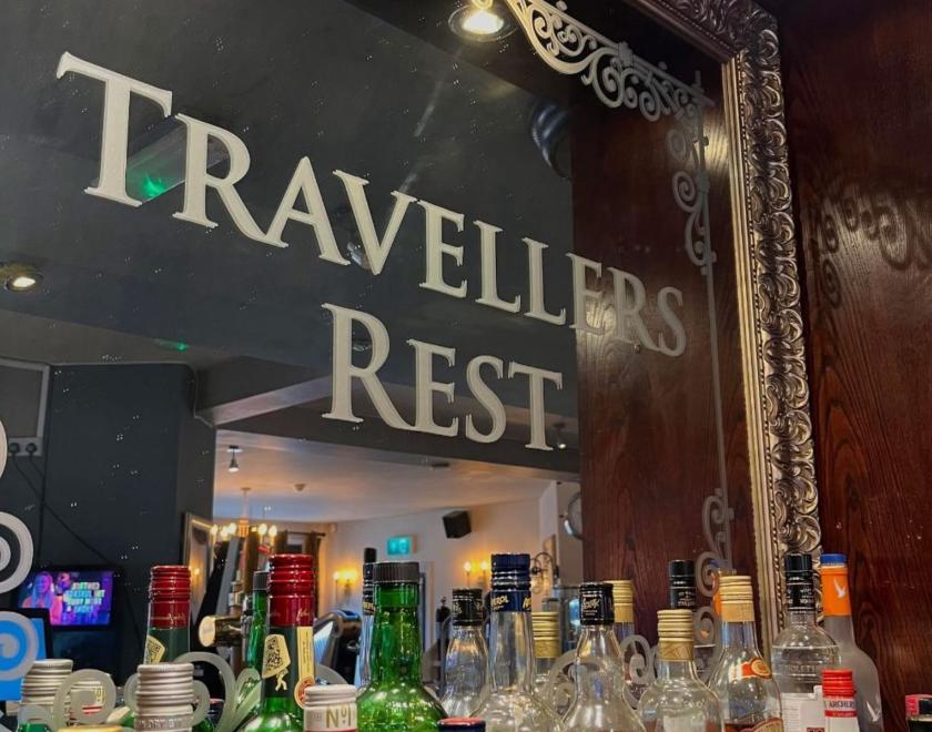 Travellers Rest Mirror, with bottles underneath 