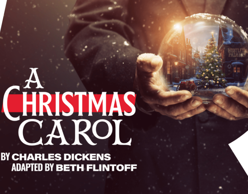 Poster for A Christmas Carol, with a man holding a snowglobe