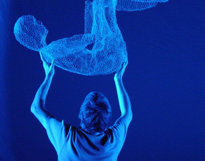 Sculpture held aloft