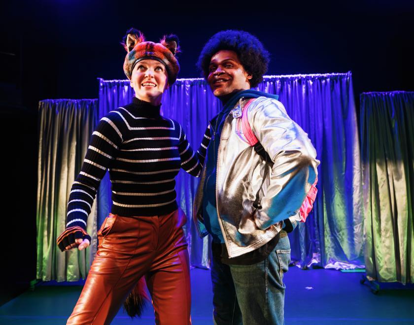 Photo of two cast members performing a scene.