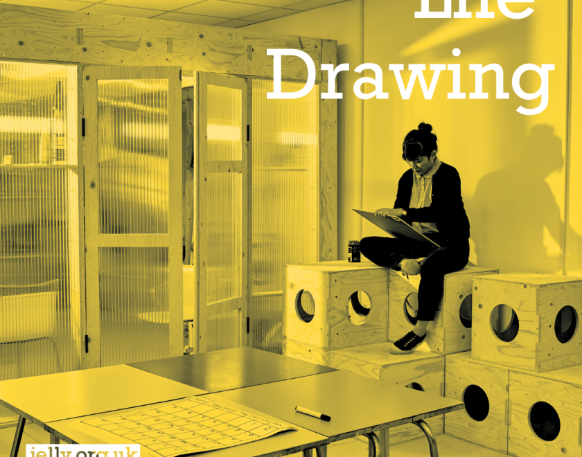 person drawing sat in an art studio