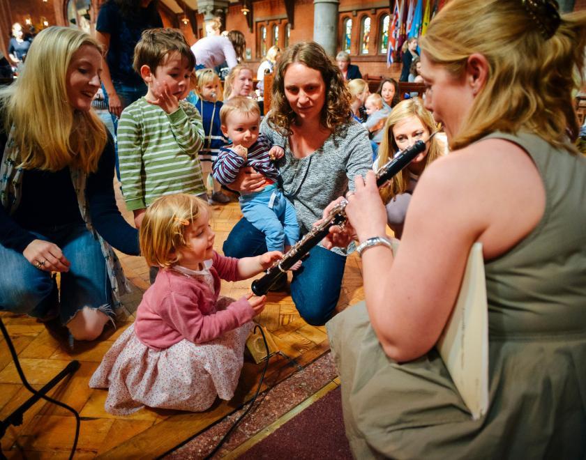 Musician performs for children