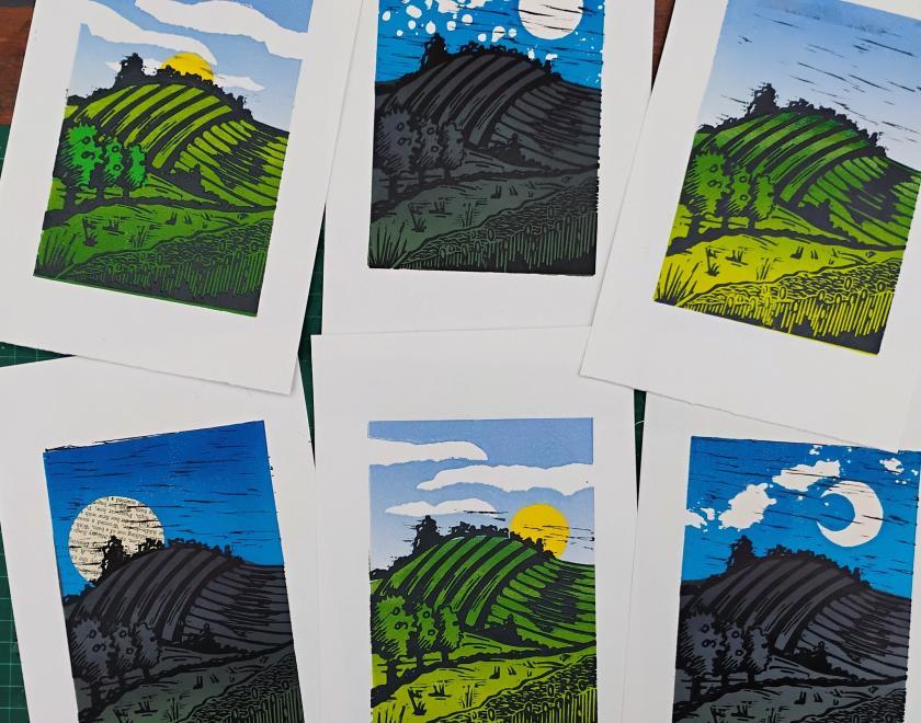 Coloured lino print landscapes on paper